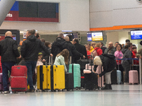 A general view of a crowd of travelers is seen at Duesseldorf Airport in Duesseldorf, Germany, on December 20, 2024, ahead of the Christmas...