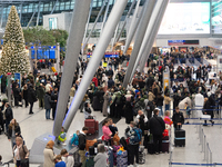 A general view of a crowd of travelers is seen at Duesseldorf Airport in Duesseldorf, Germany, on December 20, 2024, ahead of the Christmas...