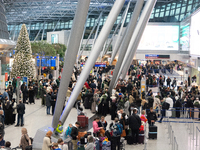 A general view of a crowd of travelers is seen at Duesseldorf Airport in Duesseldorf, Germany, on December 20, 2024, ahead of the Christmas...