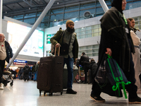 A general view of a crowd of travelers is seen at Duesseldorf Airport in Duesseldorf, Germany, on December 20, 2024, ahead of the Christmas...