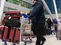 A general view of a crowd of travelers is seen at Duesseldorf Airport in Duesseldorf, Germany, on December 20, 2024, ahead of the Christmas...