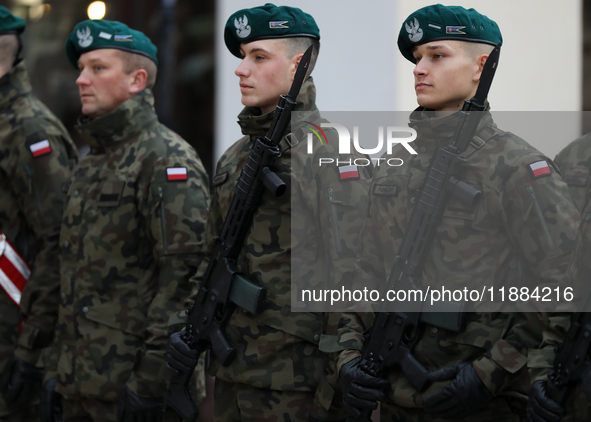 Polish Army soldiers are seen on the Main Square in Krakow, Poland, on November 24, 2024. 