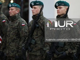 Polish Army soldiers are seen on the Main Square in Krakow, Poland, on November 24, 2024. (