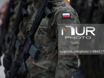 Polish Army soldiers are seen on the Main Square in Krakow, Poland, on November 24, 2024. (