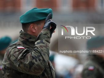 Polish Army soldiers are seen on the Main Square in Krakow, Poland, on November 24, 2024. (