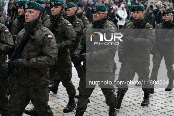 Polish Army soldiers are seen on the Main Square in Krakow, Poland, on November 24, 2024. 