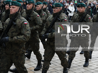 Polish Army soldiers are seen on the Main Square in Krakow, Poland, on November 24, 2024. (