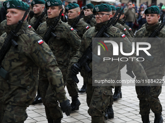 Polish Army soldiers are seen on the Main Square in Krakow, Poland, on November 24, 2024. (