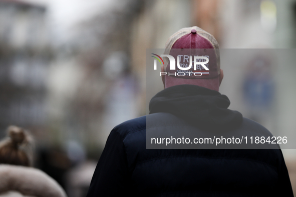 A man wears a cap with the words 'Trump 2024 the sequel' on the street in Krakow, Poland, on November 24, 2024. 