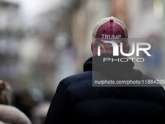 A man wears a cap with the words 'Trump 2024 the sequel' on the street in Krakow, Poland, on November 24, 2024. (