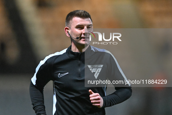 Referee Ollie Yates warms up prior to the Sky Bet League 1 match between Cambridge United and Huddersfield Town at the Cledara Abbey Stadium...