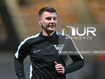 Referee Ollie Yates warms up prior to the Sky Bet League 1 match between Cambridge United and Huddersfield Town at the Cledara Abbey Stadium...