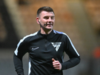 Referee Ollie Yates warms up prior to the Sky Bet League 1 match between Cambridge United and Huddersfield Town at the Cledara Abbey Stadium...