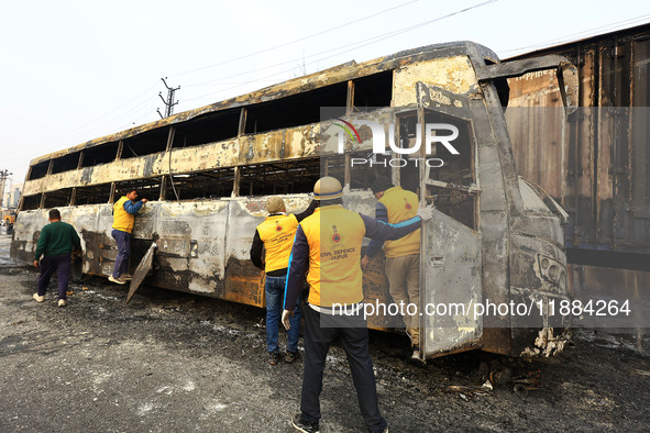 Burnt debris of vehicles is at the site of the accident after a tanker loaded with LPG collides with some other vehicles and catches fire on...