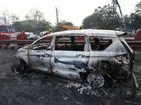 Burnt debris of vehicles is at the site of the accident after a tanker loaded with LPG collides with some other vehicles and catches fire on...