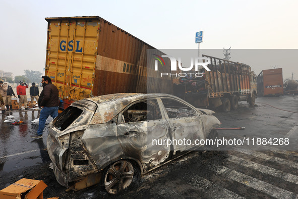 Burnt debris of vehicles is at the site of the accident after a tanker loaded with LPG collides with some other vehicles and catches fire on...