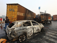 Burnt debris of vehicles is at the site of the accident after a tanker loaded with LPG collides with some other vehicles and catches fire on...