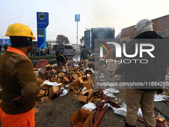 Burnt debris of vehicles is at the site of the accident after a tanker loaded with LPG collides with some other vehicles and catches fire on...