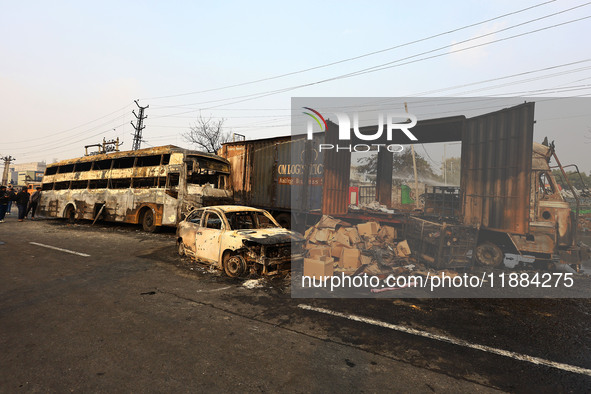 Burnt debris of vehicles is at the site of the accident after a tanker loaded with LPG collides with some other vehicles and catches fire on...