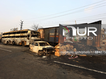 Burnt debris of vehicles is at the site of the accident after a tanker loaded with LPG collides with some other vehicles and catches fire on...