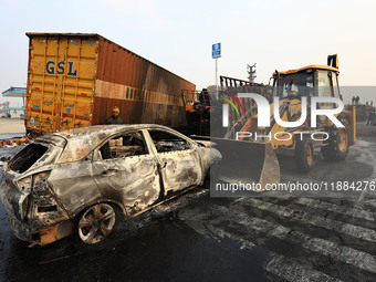 Burnt debris of vehicles is at the site of the accident after a tanker loaded with LPG collides with some other vehicles and catches fire on...