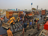 Firefighters douse the fire at the site of the accident after a tanker loaded with LPG collides with other vehicles and catches fire on the...