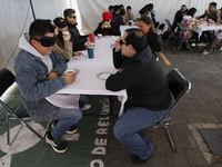 A group of blind people and volunteers meet at the Guide Dog Training School for the Blind (I.A.P) in Mexico City, Mexico, on December 20, 2...