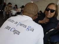 Silvia Lozada Badillo (right) is the director and founder of the Guide Dogs for the Blind Training School I.A.P in Mexico City. The school p...