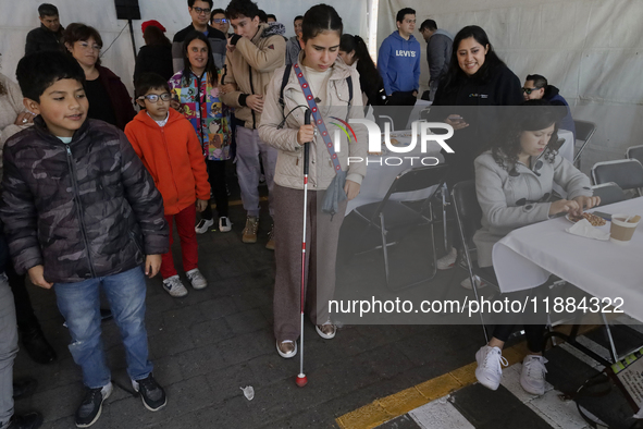 A group of blind people attends a meeting at the Guide Dog Training School for the Blind (I.A.P) in Mexico City, Mexico, on December 20, 202...