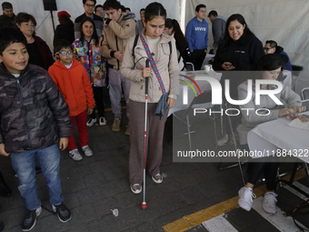 A group of blind people attends a meeting at the Guide Dog Training School for the Blind (I.A.P) in Mexico City, Mexico, on December 20, 202...