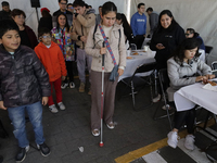 A group of blind people attends a meeting at the Guide Dog Training School for the Blind (I.A.P) in Mexico City, Mexico, on December 20, 202...