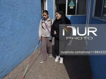 Blind people attend a meeting at the Guide Dog Training School for the Blind (I.A.P) in Mexico City, Mexico, on December 20, 2024. The schoo...