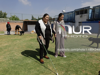 Blind women attend a meeting at the Guide Dogs for the Blind Training School I.A.P in Mexico City, Mexico. The school provides inclusive reh...