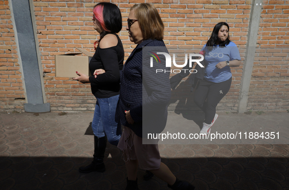 Silvia Lozada Badillo (center) is the director and founder of the Guide Dogs for the Blind Training School I.A.P in Mexico City, Mexico. The...