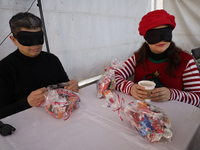 A group of blind people and volunteers meet at the Guide Dog Training School for the Blind (I.A.P) in Mexico City, Mexico, on December 20, 2...