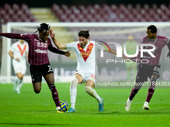 Gennaro Borrelli of Brescia Calcio and Franco Tongya of US Salernitana compete for the ball during the Serie BKT match between US Salernitan...