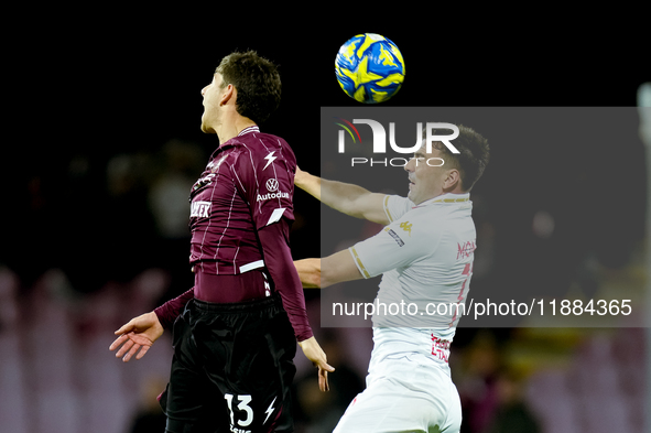 Fabio Ruggeri of US Salernitana and Gabriele Moncini of Brescia Calcio jump for the ball during the Serie BKT match between US Salernitana a...