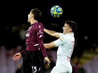 Fabio Ruggeri of US Salernitana and Gabriele Moncini of Brescia Calcio jump for the ball during the Serie BKT match between US Salernitana a...