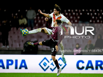 Gennaro Borrelli of Brescia Calcio and Fabio Ruggeri of US Salernitana jump for the balduring the Serie BKT match between US Salernitana and...