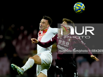 Gabriele Moncini of Brescia Calcio and Fabio Ruggeri of US Salernitana jump for the ball during the Serie BKT match between US Salernitana a...