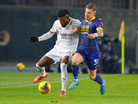 Emerson Royal of AC Milan plays against Tomas Suslov of Hellas Verona during the Italian Serie A Enilive soccer championship match between H...