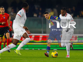 AC Milan's Rafael Leao plays against Hellas Verona's Reda Belahyane during the Italian Serie A Enilive soccer championship match between Hel...