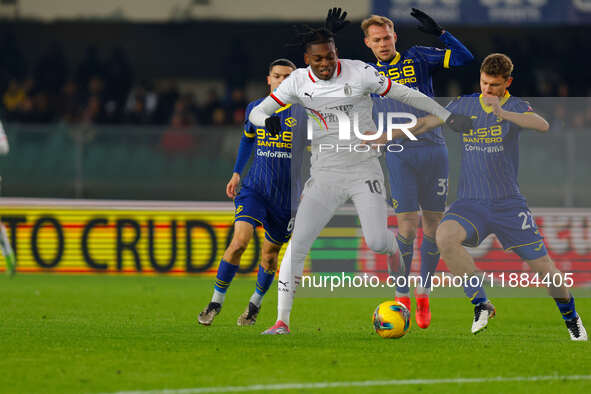 AC Milan's Rafael Leao plays against Hellas Verona's Reda Belahyane during the Italian Serie A Enilive soccer championship match between Hel...