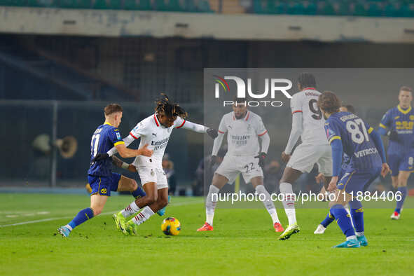 AC Milan's Samuel Chukwueze plays against Hellas Verona's Tomas Suslov during the Italian Serie A Enilive soccer championship match between...