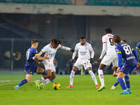 AC Milan's Samuel Chukwueze plays against Hellas Verona's Tomas Suslov during the Italian Serie A Enilive soccer championship match between...