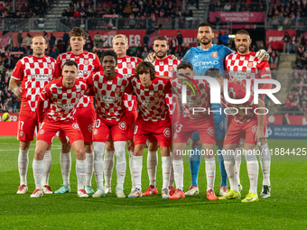 In Girona, Spain, on December 20, 2024, Girona FC players form during the LaLiga EA Sports 2024-2025 match between Girona FC and Real Vallad...