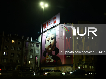 Squid Game 2 Netflix series banner is seen on th building in Warsaw, Poland on December 20, 2024. (