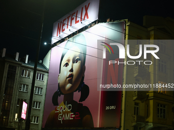 Squid Game 2 Netflix series banner is seen on th building in Warsaw, Poland on December 20, 2024. (