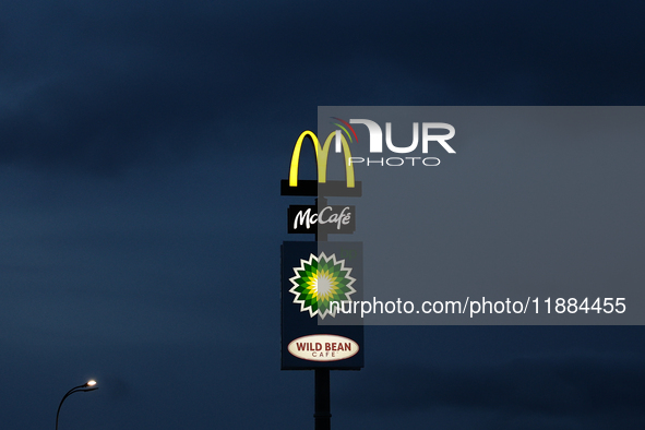 McDonald's, Mccafe, BP and Wild Bean Cafe logos are seen near the restaurant in Poland on December 20, 2024. 