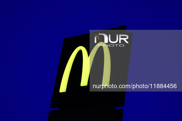 McDonald's logo is seen near the restaurant building in Poland on December 20, 2024. 